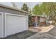 Exterior view of property with private garage and front entry with ramp for easy accessibility at 4028 Ames St, Wheat Ridge, CO 80212