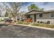 Charming single-story home featuring a well-maintained lawn, brick accents, and ample parking space at 4028 Ames St, Wheat Ridge, CO 80212