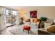 Bright and inviting living room with sliding glass doors to the patio and comfortable seating at 4028 Ames St, Wheat Ridge, CO 80212