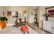 Open concept living area showcases modern flooring, neutral paint colors, and a view to the kitchen at 4028 Ames St, Wheat Ridge, CO 80212
