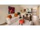 Cozy living room featuring stylish decor, comfortable seating, and modern flooring at 4028 Ames St, Wheat Ridge, CO 80212