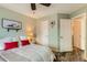 Serene bedroom features a ceiling fan, wood-look flooring, and an open closet at 4028 Ames St, Wheat Ridge, CO 80212