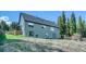 The home's backyard features a grassy area and a view of the surrounding trees at 234 Carroll Ln, Breckenridge, CO 80424