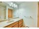 Spacious bathroom featuring a long countertop, large mirror, and shower-tub combo at 234 Carroll Ln, Breckenridge, CO 80424