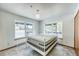Bright bedroom with white metal frame bed and large windows overlooking the outdoors at 234 Carroll Ln, Breckenridge, CO 80424