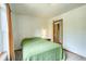 Serene bedroom features a cozy bed, a small side table, and a window with natural light at 234 Carroll Ln, Breckenridge, CO 80424