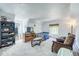 Cozy carpeted bedroom area featuring a full-sized bed and leather chair at 234 Carroll Ln, Breckenridge, CO 80424