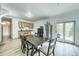 Dining area features a table with seating for six, wood-look floors, and access to the deck at 234 Carroll Ln, Breckenridge, CO 80424