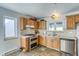 Well lit kitchen with stainless steel appliances, wood cabinets, stone floors, and white countertops at 234 Carroll Ln, Breckenridge, CO 80424