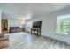 Bright living room featuring hardwood floors, large windows, and comfortable seating at 234 Carroll Ln, Breckenridge, CO 80424
