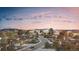 Stunning aerial view of Crystal Valley neighborhood homes and Colorado landscape at sunset at 5326 Lions Paw St, Castle Rock, CO 80104