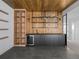 Chic bar area with wood accents, shelving, cabinets, and wine fridge at 5326 Lions Paw St, Castle Rock, CO 80104