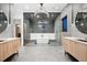 Modern bathroom with dual vanities, a glass-enclosed shower, and a soaking tub beneath a chandelier at 5326 Lions Paw St, Castle Rock, CO 80104