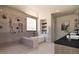 Luxurious bathroom with a soaking tub, walk-in shower, and elegant fixtures, a private oasis at 5326 Lions Paw St, Castle Rock, CO 80104