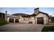Luxury estate exterior with stone accents, three-car garage, and mountain views at 5326 Lions Paw St, Castle Rock, CO 80104