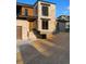 Modern home with stone facade, wood accents, and a neatly landscaped front yard at 5326 Lions Paw St, Castle Rock, CO 80104