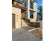 Beautiful modern home featuring stone facade, dark trim windows and an elegant entryway with concrete steps at 5326 Lions Paw St, Castle Rock, CO 80104