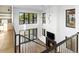 Bright living room features a fireplace, large windows, and wood floors at 5326 Lions Paw St, Castle Rock, CO 80104