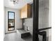 Contemporary mudroom with gray tiled floors, custom cabinets, and a convenient dog washing station at 5326 Lions Paw St, Castle Rock, CO 80104