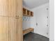 Well-organized mudroom with built-in storage, coat hooks, and bench for easy organization at 5326 Lions Paw St, Castle Rock, CO 80104