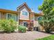 Beautiful backyard showcasing a grassy area with trees, shrubbery, and beige siding at 5976 S Jellison St # E, Littleton, CO 80123