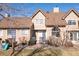 Attractive backyard with grass, trees, patio, and playground equipment at 5976 S Jellison St # E, Littleton, CO 80123