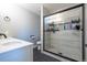 Stylish bathroom with a glass-enclosed shower and modern fixtures for a sleek and sophisticated look at 5976 S Jellison St # E, Littleton, CO 80123