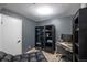 Comfortable bedroom showcasing a desk, rolling chair, and dark bookshelf at 5976 S Jellison St # E, Littleton, CO 80123