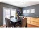 Elegant dining room showcases stylish furnishings, wood floors, storage, and sliding door access to the outdoors at 5976 S Jellison St # E, Littleton, CO 80123