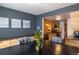 Elegant dining room showcases stylish furnishings, wood floors, storage, and seamlessly adjoins the well-equipped kitchen at 5976 S Jellison St # E, Littleton, CO 80123