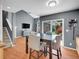 Open floor plan with a dining area, stairway, and a glimpse into an adjacent living room at 5976 S Jellison St # E, Littleton, CO 80123