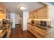 Bright kitchen features granite countertops, stainless steel appliances, and natural wood cabinets at 5976 S Jellison St # E, Littleton, CO 80123