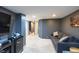 Relaxing living room with gray walls, plush sofa, and modern decor at 5976 S Jellison St # E, Littleton, CO 80123