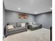 Cozy living room with gray walls, recessed lighting and comfortable seating at 5976 S Jellison St # E, Littleton, CO 80123
