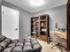 Office with a comfortable chaise lounge, desk, computer and bookshelves at 5976 S Jellison St # E, Littleton, CO 80123