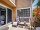 Outdoor patio featuring several comfortable chairs and a sliding glass door at 5976 S Jellison St # E, Littleton, CO 80123