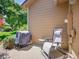 View of backyard patio area with grill, table and outdoor seating at 5976 S Jellison St # E, Littleton, CO 80123