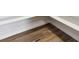 Unfinished basement with wood-look flooring, offering potential for customization at 13695 Emerald Lake St, Parker, CO 80138