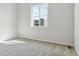 Cozy bedroom with plush carpeting, a large window for ample natural light, and neutral walls at 13695 Emerald Lake St, Parker, CO 80138