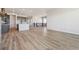 Living room with kitchen, stairs, and second floor hall. Open-concept home with lots of light at 13695 Emerald Lake St, Parker, CO 80138