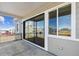 Covered patio with sliding glass door, offering an outdoor space for relaxation at 13695 Emerald Lake St, Parker, CO 80138