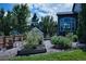 Landscaped backyard with a greenhouse and garden at 7408 Sodalite Way, Castle Rock, CO 80108