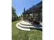 Outdoor patio with a pergola, dining set, and manicured lawn at 7408 Sodalite Way, Castle Rock, CO 80108