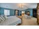 Spacious main bedroom with ensuite bathroom, sitting area, and vaulted ceiling at 7408 Sodalite Way, Castle Rock, CO 80108