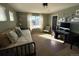 Well-lit bedroom featuring a daybed, desk area, and large window offering a view to the outside at 7408 Sodalite Way, Castle Rock, CO 80108