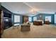 Spacious main bedroom with a sitting area, vaulted ceiling, and large windows at 7408 Sodalite Way, Castle Rock, CO 80108