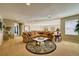 Open-concept bonus room with plush seating and natural light at 7408 Sodalite Way, Castle Rock, CO 80108