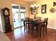 Charming breakfast nook with wood floors and sliding door leading to backyard at 7408 Sodalite Way, Castle Rock, CO 80108