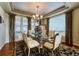 Elegant dining room with stylish chandelier, table and decorative rug at 7408 Sodalite Way, Castle Rock, CO 80108
