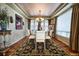 Elegant dining room featuring a chandelier, decorative rug, and large windows, ideal for formal gatherings and Gathering meals at 7408 Sodalite Way, Castle Rock, CO 80108